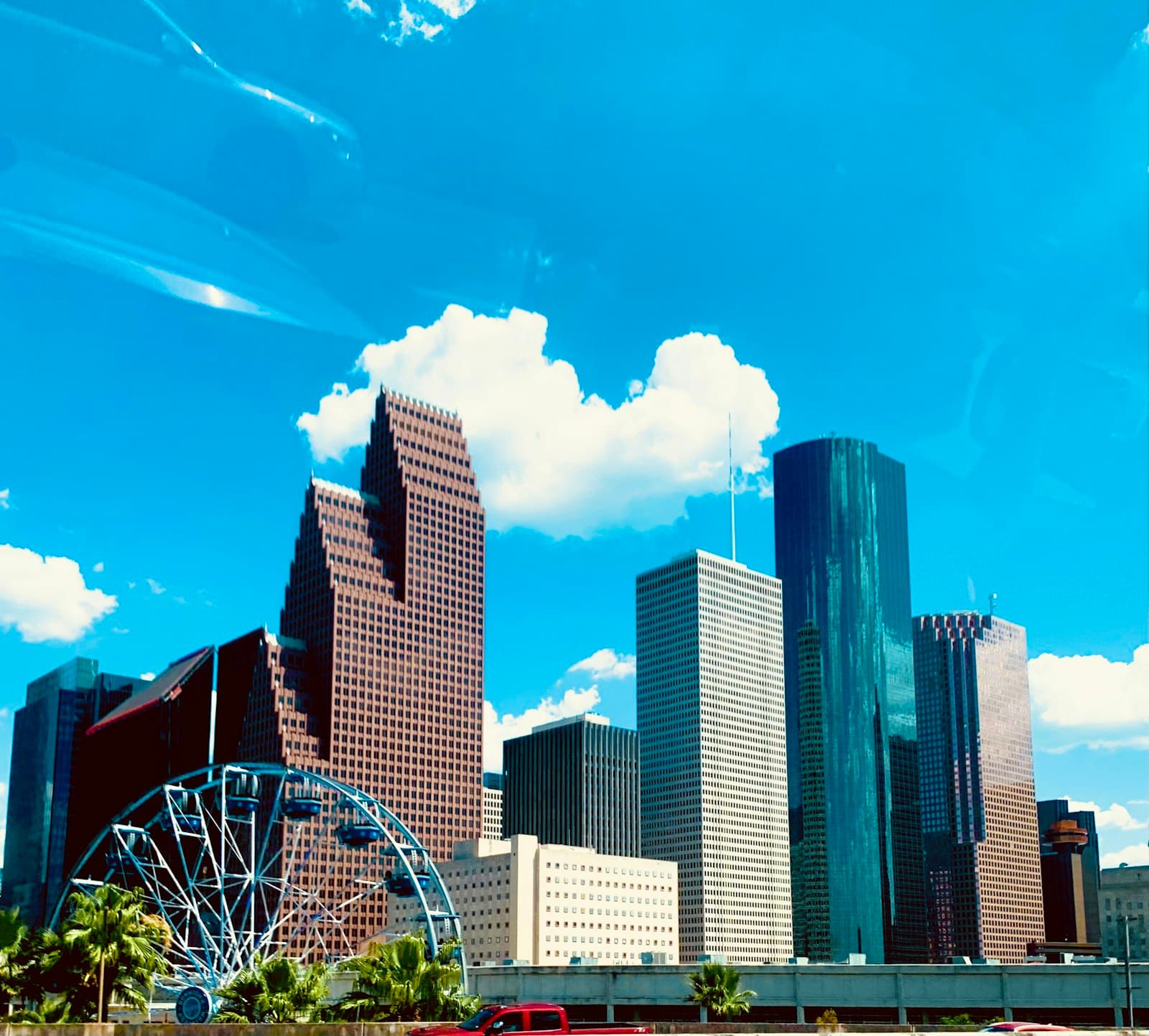 Downtown Houston towers under a blue sky